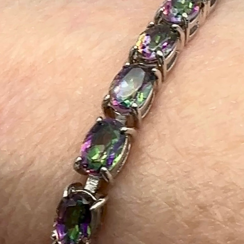 High end mystic quartz tennis bracelet set in rhodium over S925.